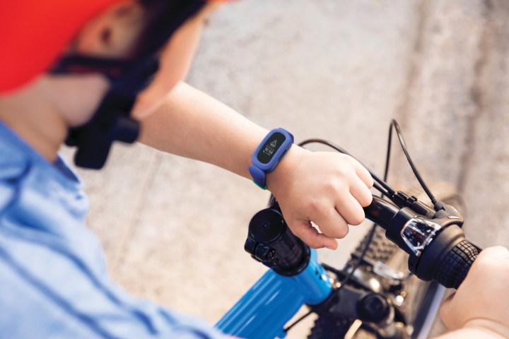 A kid wearing the Fitbit Ace 2.