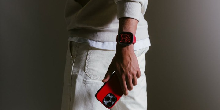 Someone holding an iPhone with a Nomad case.