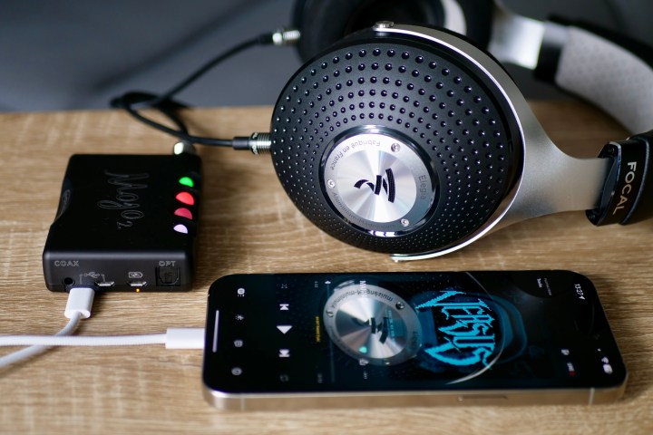 The iPhone 15 Pro Max connected to the Chord Mojo 2, and the Focal Elegia headphones.
