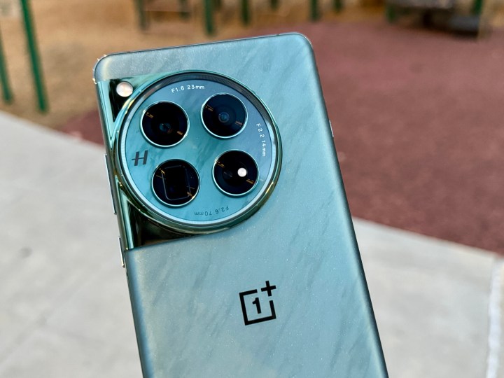 OnePlus 12 Flowy Emerald closeup showing top half of back with camera.