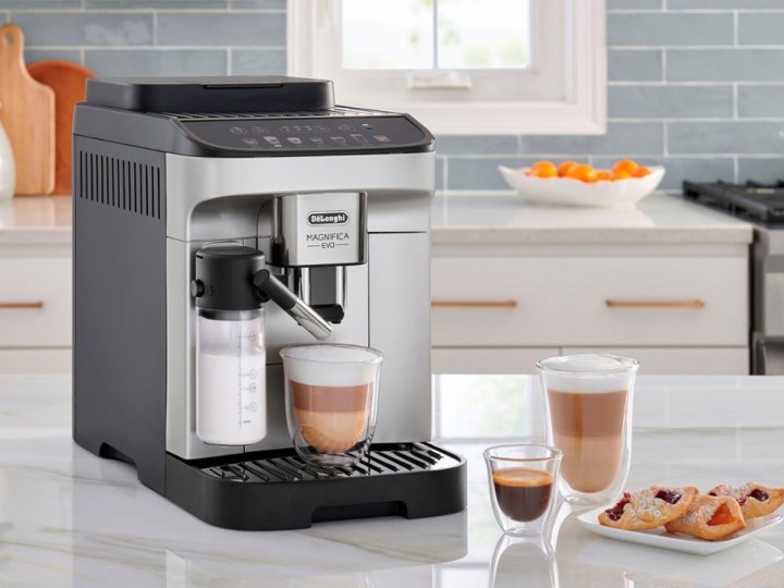 The De’Longhi Magnifica Evo coffee and espresso machine on a kitchen counter.
