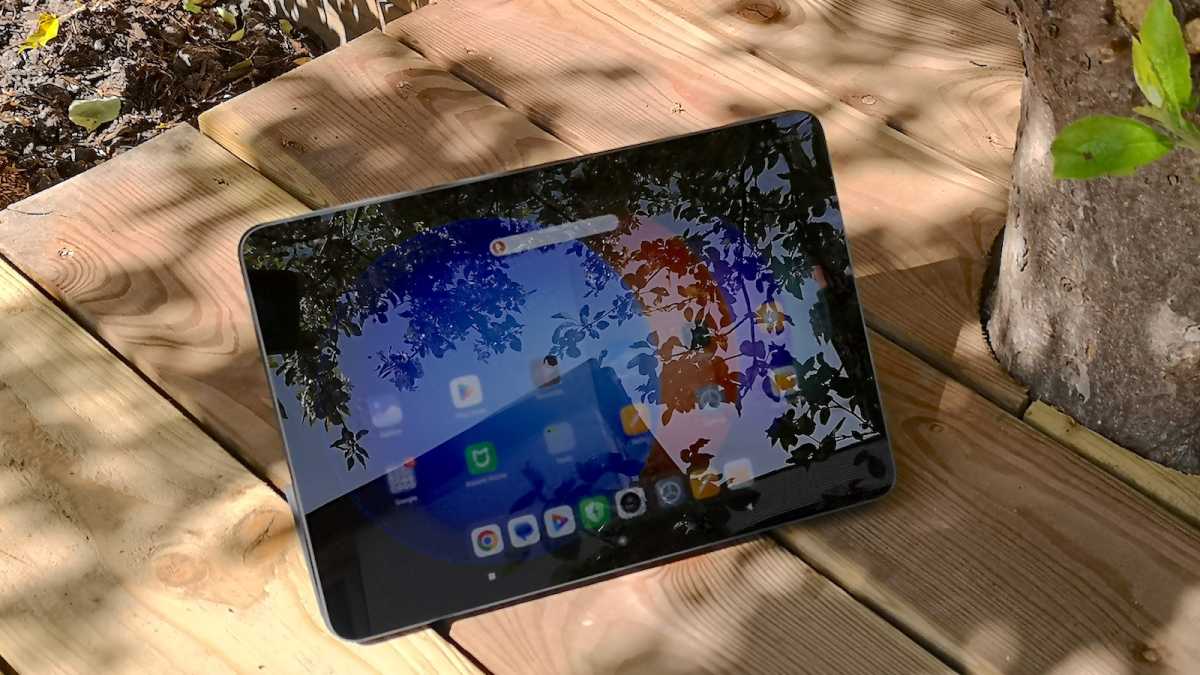 A Xiaomi Pad 6S Pro with brightness on full, punching through the glare of the midday sun